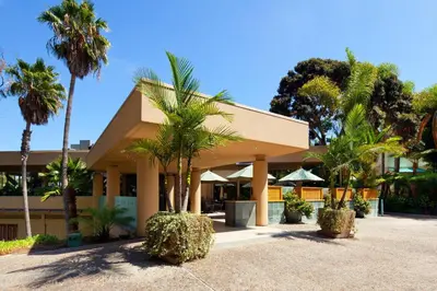 a building with palm trees in front of it at Sheraton La Jolla in San Diego