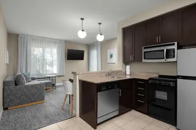 a kitchen with a sink and a microwave at TownePlace Suites by Marriott San Diego Carlsbad / Vista in Vista