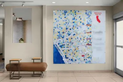 a large painting of a map on a wall at TownePlace Suites by Marriott San Diego Carlsbad / Vista in Vista