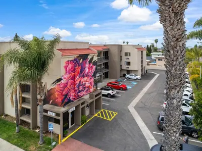 an aerial view of a hotel with a parking lot at Hotel Milagro in Chula Vista
