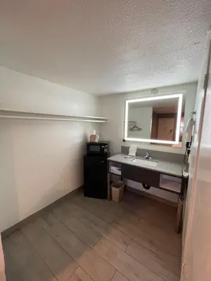 a bathroom with a sink and a mirror at Hotel Milagro in Chula Vista