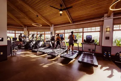 a group of people exercising on treadmills in a gym at Guesthouse Hotel at La Valle in Rancho Santa Fe