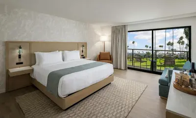 a bedroom with a large bed and a large window at Guesthouse Hotel at La Valle in Rancho Santa Fe