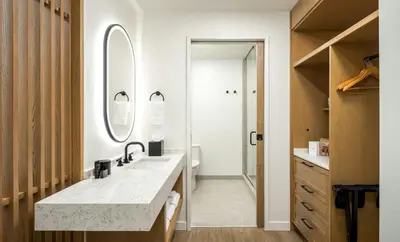 a bathroom with a sink and a mirror at Guesthouse Hotel at La Valle in Rancho Santa Fe
