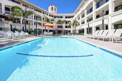 a swimming pool in front of a building at Homewood Suites By Hilton San Diego Central in San Diego