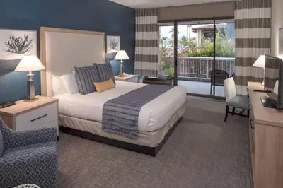 a hotel room with a bed and a balcony at Bay Club Hotel and Marina in San Diego
