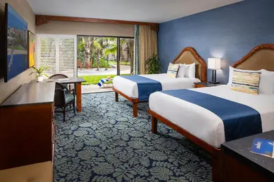 a hotel room with two beds and a window at Catamaran Resort Hotel and Spa in San Diego