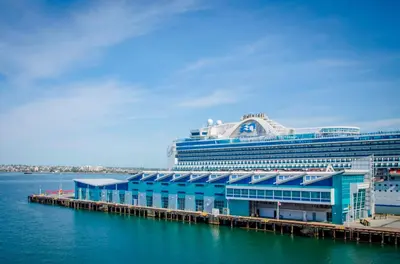 a cruise ship docked at a dock in the water at Travelodge by Wyndham San Diego SeaWorld in San Diego