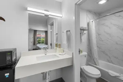 a white bathroom with a sink and a toilet at Motel 6-La Mesa, CA in San Diego