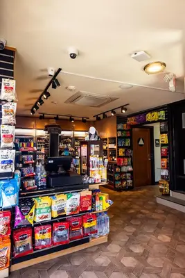 a grocery store aisle with products on display at Cormorant Boutique Hotel in San Diego