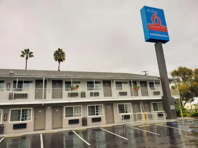 a building with a sign in front of it at Studio 6-National City, CA - Naval Base San Diego in National City