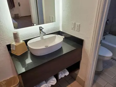 a bathroom with a sink and a toilet at Studio 6-National City, CA - Naval Base San Diego in National City