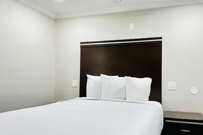 a large white bed in a hotel room at Rodeway Inn Lemon Grove San Diego East in Lemon Grove