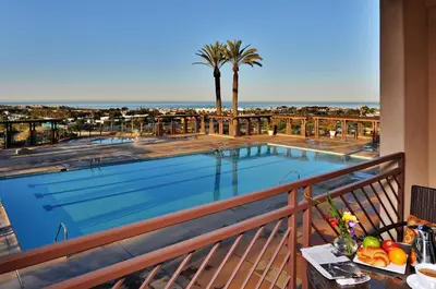 a view of a swimming pool from a balcony at Grand Pacific Palisades Resort in Carlsbad