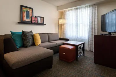 a living room with a couch and a tv at Residence Inn San Diego Sorrento Mesa/Sorrento Valley in Sorrento