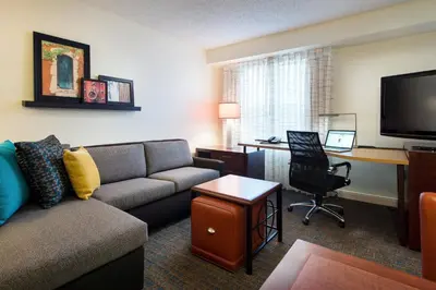 a living room with a couch and a desk with a computer at Residence Inn San Diego Sorrento Mesa/Sorrento Valley in Sorrento