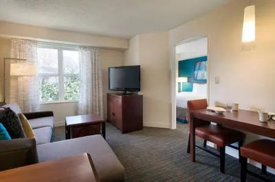 a living room with a couch and a flat screen tv at Residence Inn San Diego Sorrento Mesa/Sorrento Valley in Sorrento