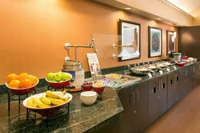 a buffet line with fruit in bowls on a counter at Residence Inn San Diego Sorrento Mesa/Sorrento Valley in Sorrento