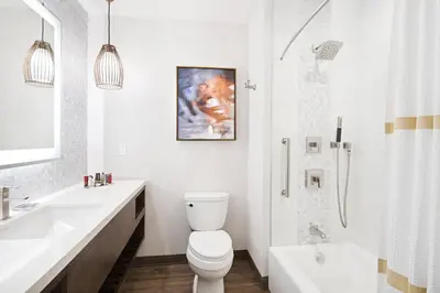 a bathroom with a toilet and a sink and a shower at San Diego Marriott Del Mar in San Diego