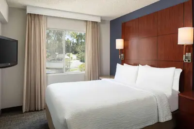 a hotel room with a large bed and a window at Sonesta ES Suites Carmel Mountain - San Diego in San Diego