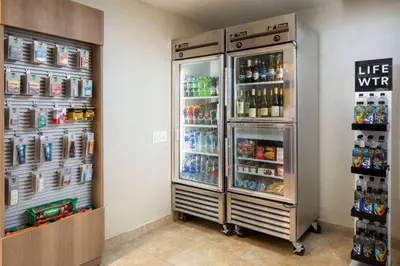 a refrigerator in a store with drinks in it at Sonesta ES Suites Carmel Mountain - San Diego in San Diego
