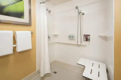 a bathroom with a shower and a toilet in it at Courtyard Irvine John Wayne Airport/Orange County in Irvine