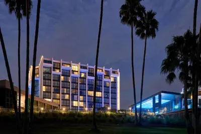 a building with a lit up facade at night at VEA Newport Beach, a Marriott Resort & Spa in Newport Beach