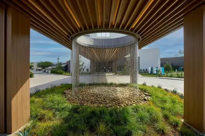a building with a large wooden structure with a circle of grass at VEA Newport Beach, a Marriott Resort & Spa in Newport Beach