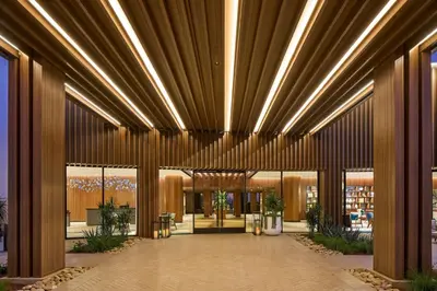 a lobby of a building with a large wooden ceiling at VEA Newport Beach, a Marriott Resort & Spa in Newport Beach