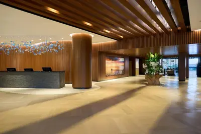 a lobby with a reception desk in a building at VEA Newport Beach, a Marriott Resort & Spa in Newport Beach