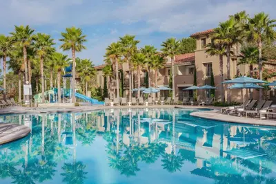 a pool at a resort with palm trees at Marriott's Newport Coast Villas in Newport Beach