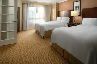 a hotel room with two beds and a window at Newport Beach Marriott Bayview in Newport Beach