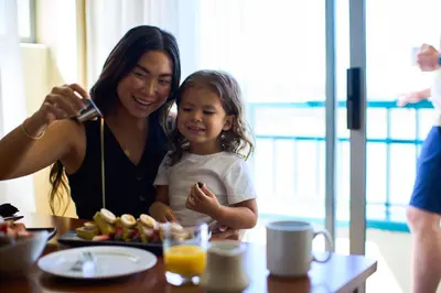 a woman and a little girl sitting at a table at Newport Beach Marriott Bayview in Newport Beach