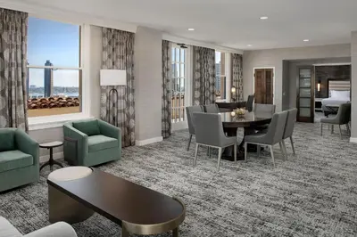 a living room with a table and chairs at Courtyard by Marriott San Diego Downtown in San Diego
