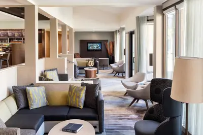 a living room with a couch and chairs at Courtyard by Marriott San Diego Sorrento Valley in Sorrento
