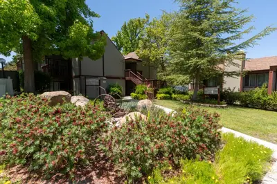 a house with a yard with flowers and trees at San Diego Country Estates in Ramona