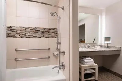 a bathroom with a tub and a sink at Coronado Island Marriott Resort & Spa in San Diego