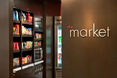 a store door with the market sign on it next to a refrigerator at Courtyard Foothill Ranch Irvine East/Lake Forest in Foothill Ranch
