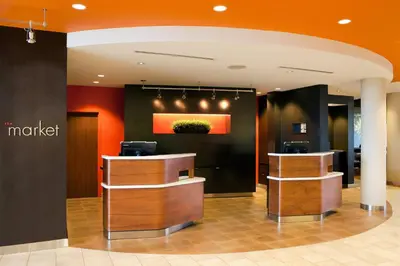 a lobby of a store with a waiting room with a counter at Courtyard Foothill Ranch Irvine East/Lake Forest in Foothill Ranch