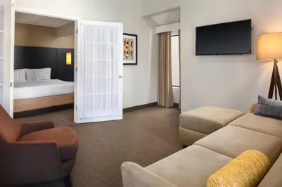 a hotel room with a couch and a bed at Residence Inn Irvine Spectrum in Irvine