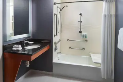 a bathroom with a sink and a tub and a shower at Residence Inn Irvine Spectrum in Irvine