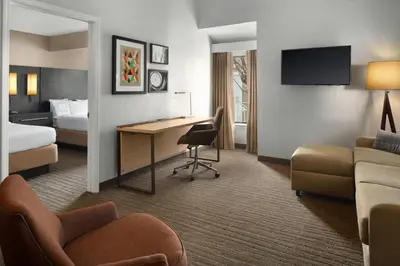 a hotel room with a desk and a bed at Residence Inn Irvine Spectrum in Irvine