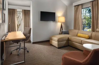 a hotel room with a couch and a table at Residence Inn Irvine Spectrum in Irvine