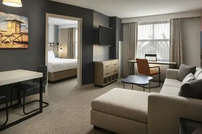 a hotel room with a couch and a bedroom at Residence Inn Irvine John Wayne Airport Orange County in Irvine