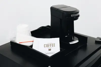 a coffee box sitting on a counter with a coffee maker at Hotel Ash&9th in San Diego
