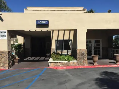a lobby of a hotel with a sign on it at Chula Vista Inn in Chula Vista