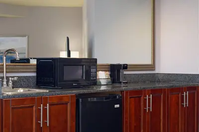 a kitchen counter with a microwave and a sink at Courtyard San Diego Old Town in San Diego