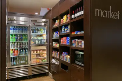 a grocery store aisle with a refrigerator and drinks at Courtyard San Diego Old Town in San Diego
