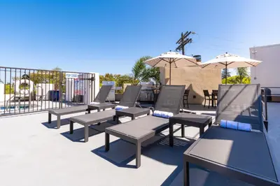 a row of chairs and umbrellas on a patio at Coronado Beach Resort in San Diego