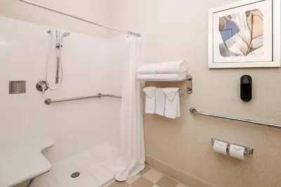 a bathroom with a shower and a toilet at Fairfield Inn & Suites Temecula in Temecula